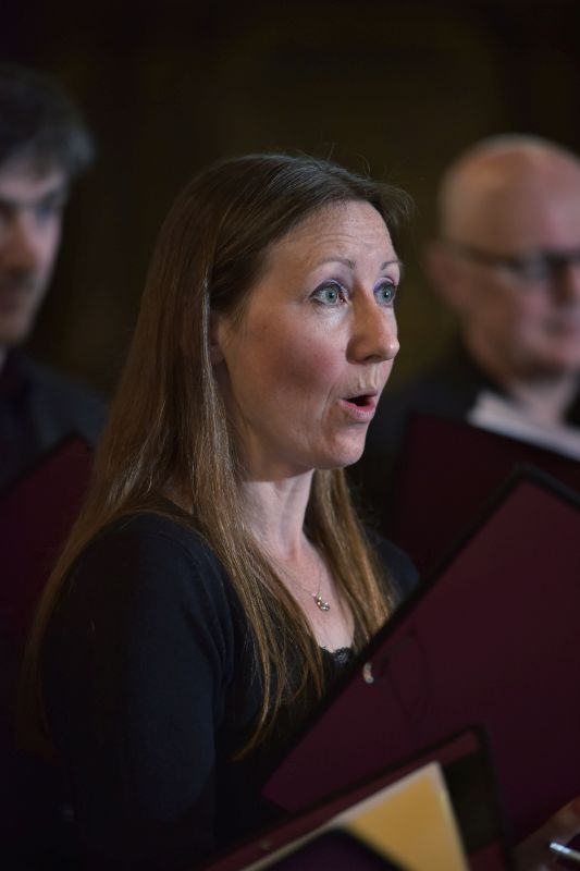 Jess, with Ben and Peter in the background – Members of the Chandos Chamber Choir rehearsing in St Sepulchre Church in the City of London